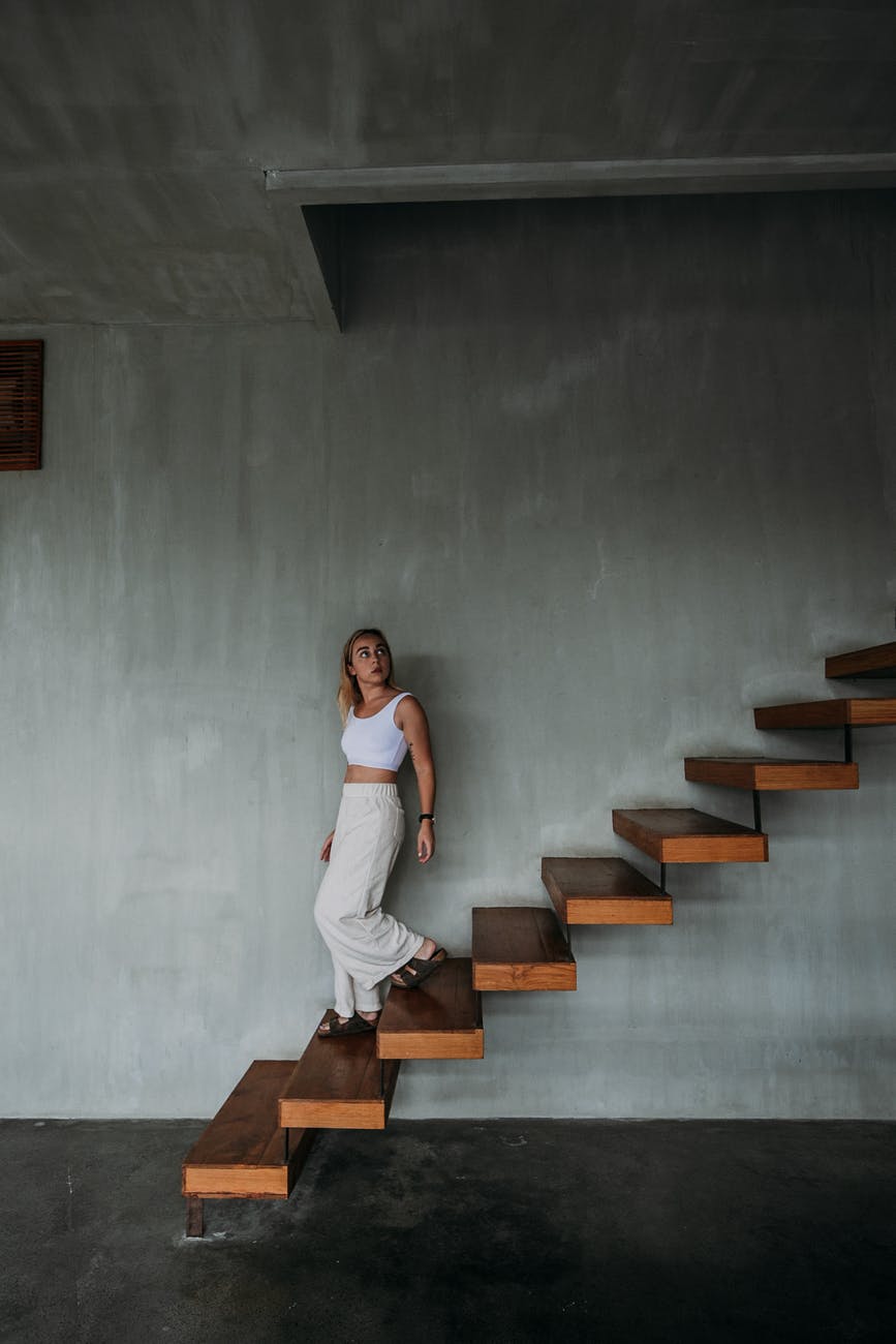 young woman on stairs in modern building